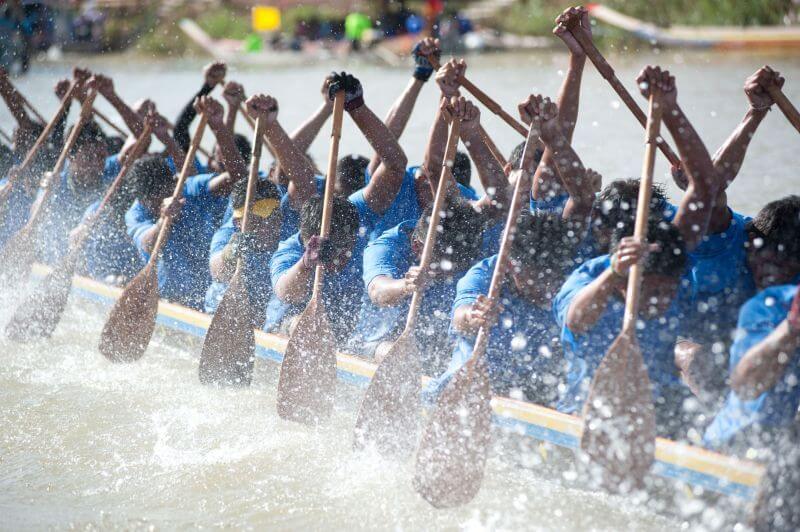 Rowing team demonstrating teamwork in a race